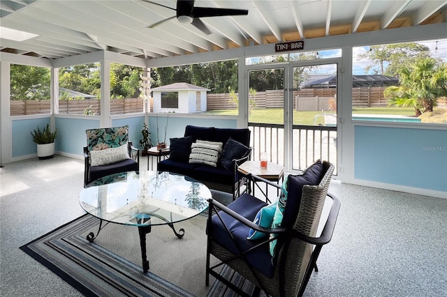 sunroom featuring ceiling fan