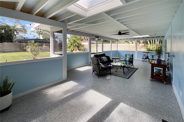 sunroom featuring ceiling fan