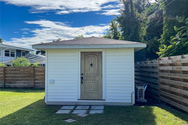 view of shed featuring a fenced backyard