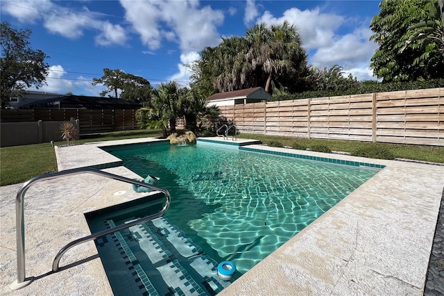 view of pool featuring a patio, a fenced backyard, and a fenced in pool