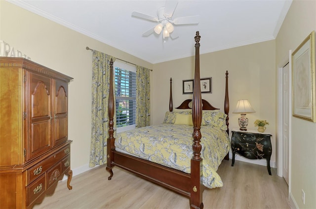 bedroom featuring light wood-style floors, a ceiling fan, baseboards, and crown molding