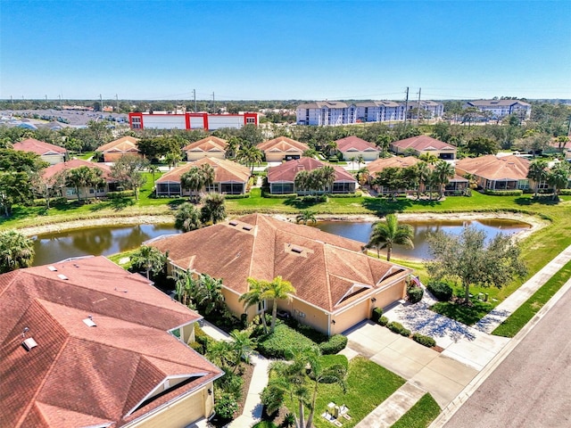 bird's eye view featuring a residential view and a water view