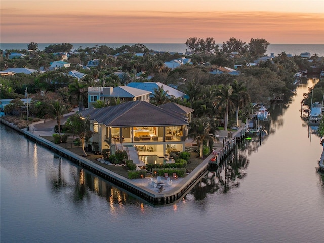 aerial view at dusk with a water view