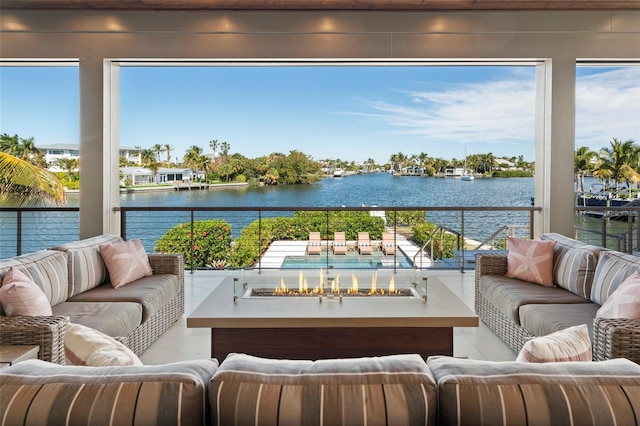 sunroom featuring a water view and a healthy amount of sunlight