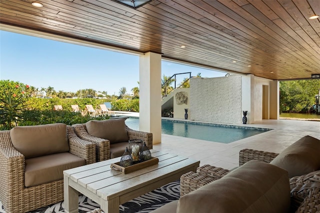 view of patio / terrace featuring an outdoor pool and outdoor lounge area