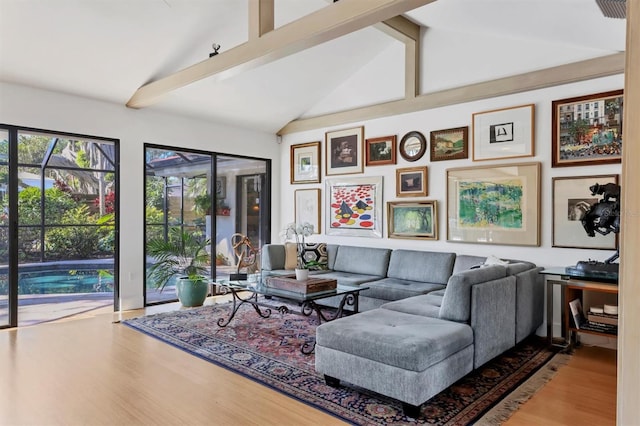 1610 S Lake Shore Dr, Sarasota, FL 34231 - living room with vaulted ceiling with beams and wood finished floors