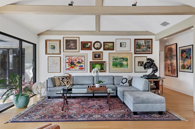 1610 S Lake Shore Dr, Sarasota, FL 34231 - living area with visible vents, baseboards, wood finished floors, and vaulted ceiling