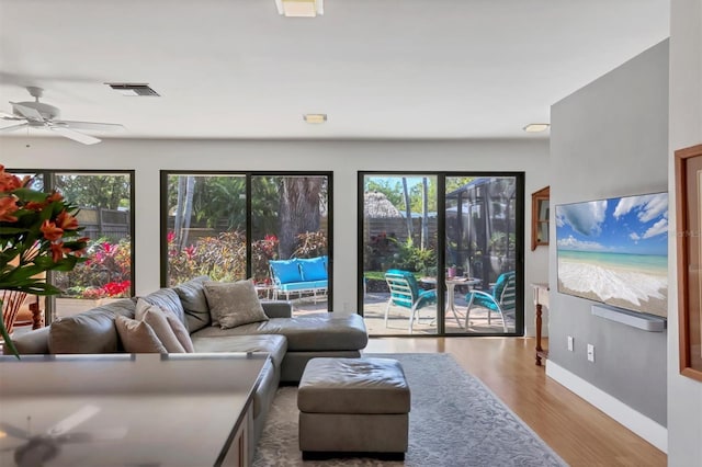 1610 S Lake Shore Dr, Sarasota, FL 34231 - living area featuring visible vents, baseboards, a ceiling fan, and wood finished floors