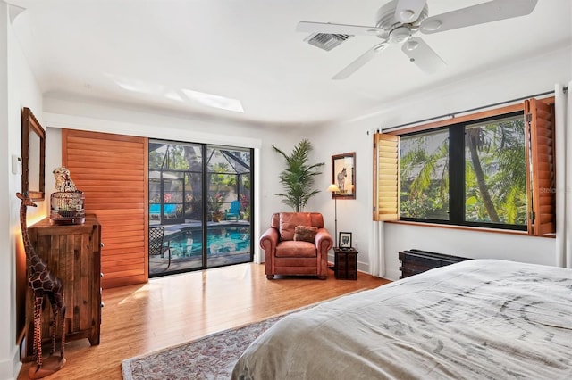1610 S Lake Shore Dr, Sarasota, FL 34231 - bedroom with visible vents, wood finished floors, access to exterior, and a ceiling fan