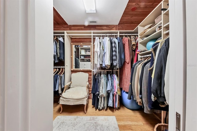 1610 S Lake Shore Dr, Sarasota, FL 34231 - walk in closet featuring wood finished floors