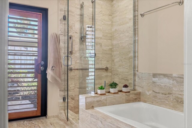 1610 S Lake Shore Dr, Sarasota, FL 34231 - bathroom featuring a shower stall and a garden tub