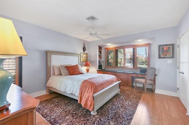 1610 S Lake Shore Dr, Sarasota, FL 34231 - bedroom with light wood finished floors, visible vents, a ceiling fan, and baseboards