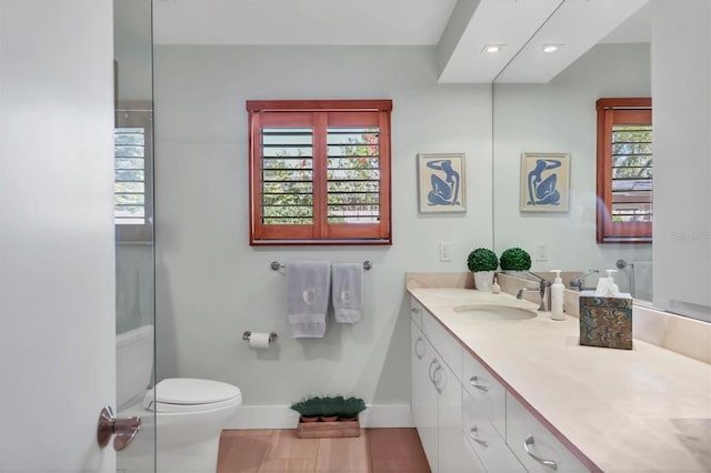 1610 S Lake Shore Dr, Sarasota, FL 34231 - bathroom featuring toilet, recessed lighting, tile patterned flooring, baseboards, and vanity