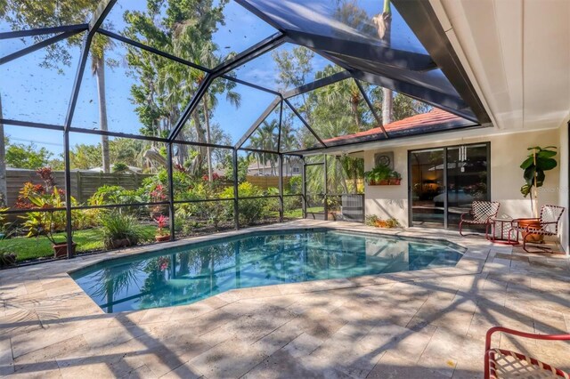 1610 S Lake Shore Dr, Sarasota, FL 34231 - outdoor pool featuring glass enclosure and a patio