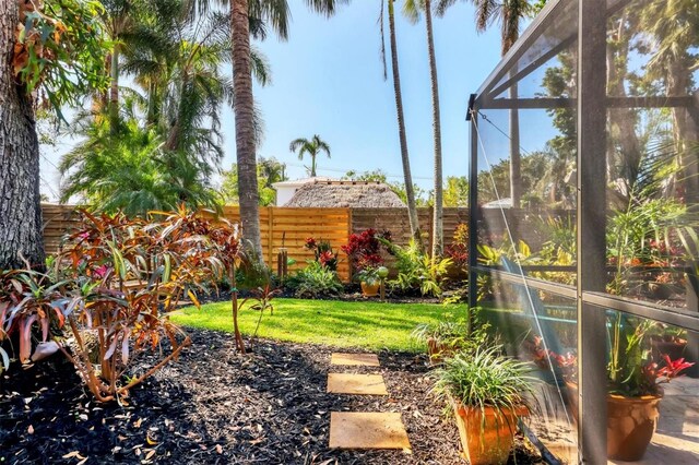 1610 S Lake Shore Dr, Sarasota, FL 34231 - view of yard featuring a lanai and fence