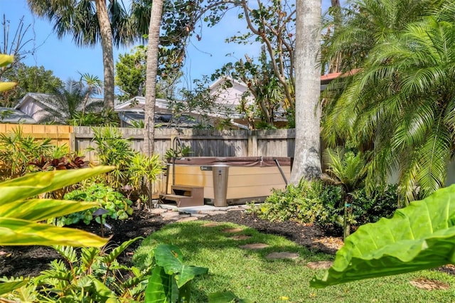 1610 S Lake Shore Dr, Sarasota, FL 34231 - view of yard featuring a hot tub and fence