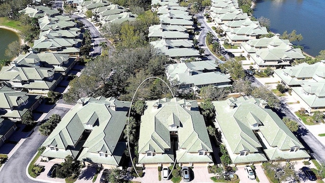 aerial view with a water view and a residential view