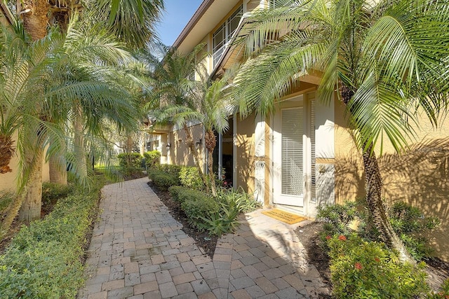 view of side of property featuring stucco siding