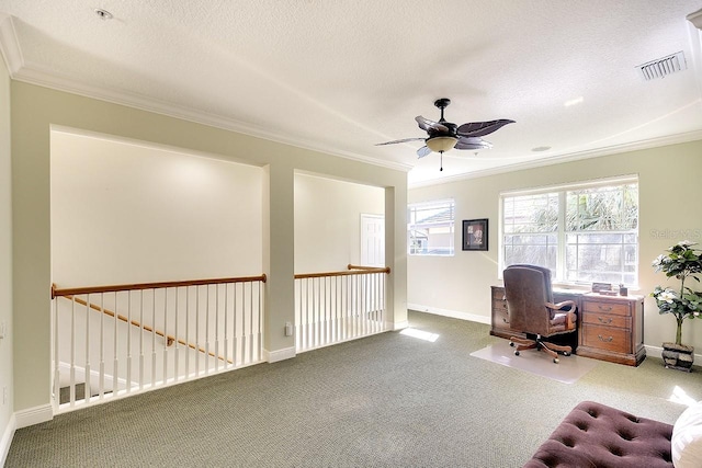 carpeted office space with baseboards, visible vents, a textured ceiling, and ornamental molding