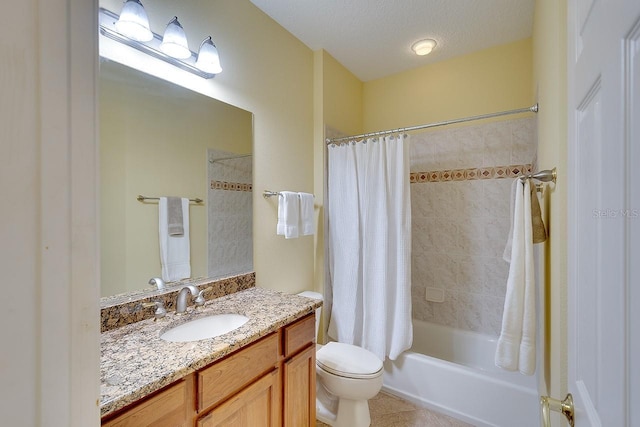 bathroom featuring a textured ceiling, vanity, toilet, and shower / bath combo with shower curtain