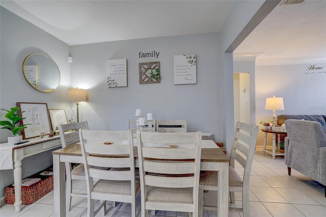 dining area with light tile patterned floors