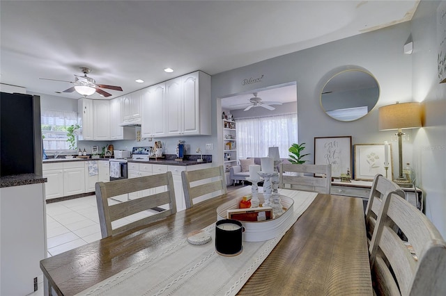 dining area with ceiling fan, recessed lighting, and light tile patterned flooring