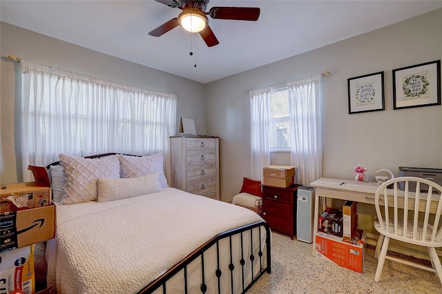 bedroom featuring light speckled floor and ceiling fan