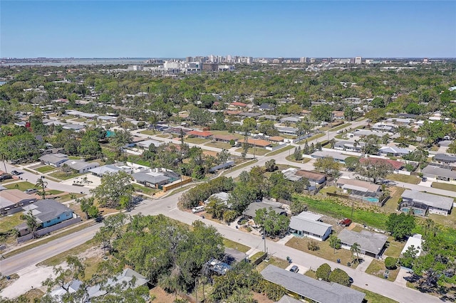 birds eye view of property with a view of city and a residential view