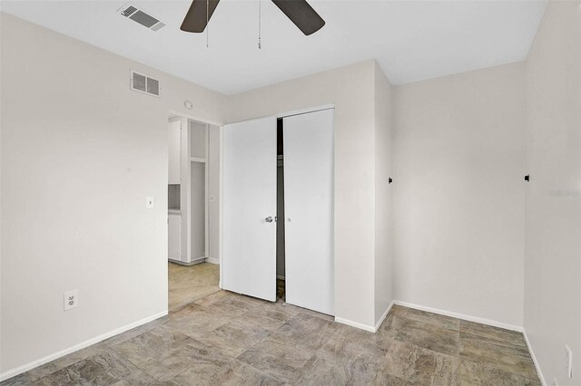 unfurnished bedroom with baseboards and visible vents