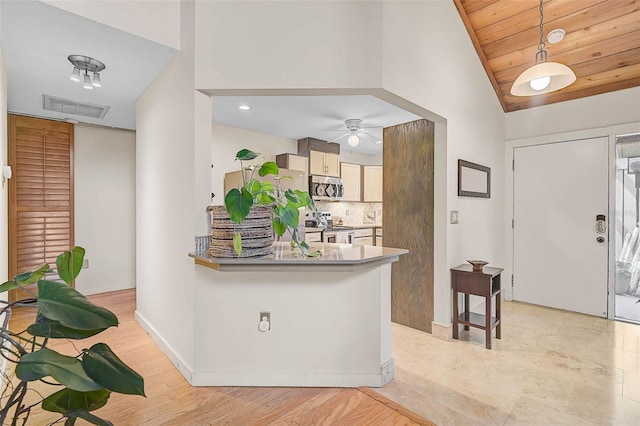 interior space with visible vents, baseboards, lofted ceiling, wooden ceiling, and ceiling fan