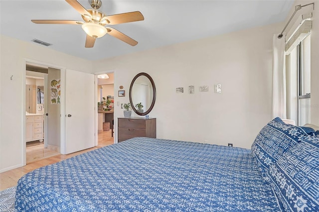 bedroom with connected bathroom, visible vents, baseboards, a ceiling fan, and light wood finished floors