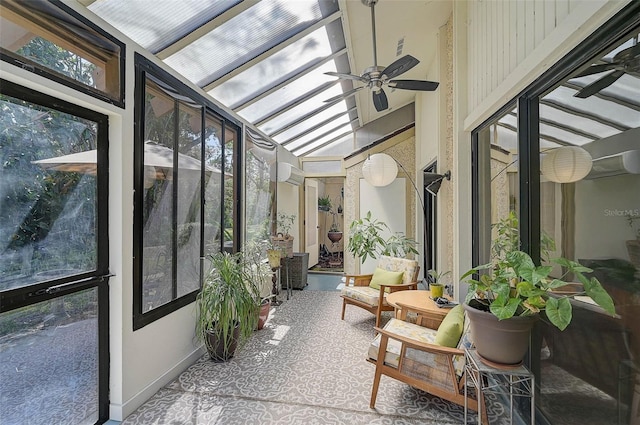 sunroom featuring lofted ceiling and a ceiling fan