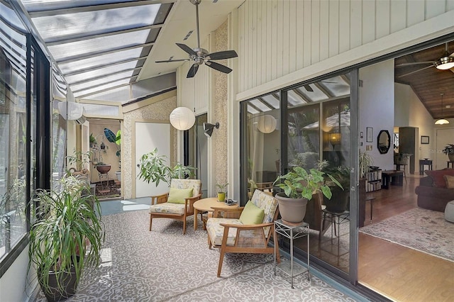 sunroom featuring lofted ceiling and ceiling fan