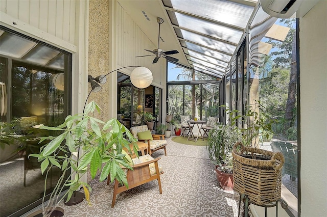 sunroom / solarium with a healthy amount of sunlight, vaulted ceiling, and a ceiling fan