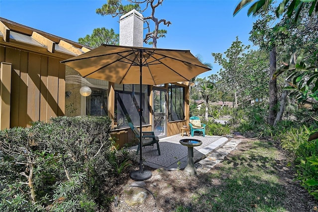 view of patio / terrace with a lanai