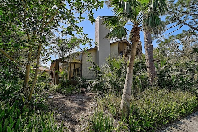 view of property exterior with stucco siding