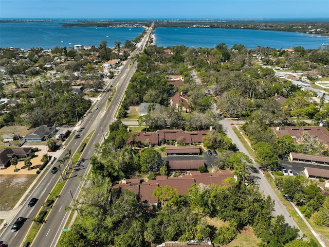 birds eye view of property featuring a residential view and a water view