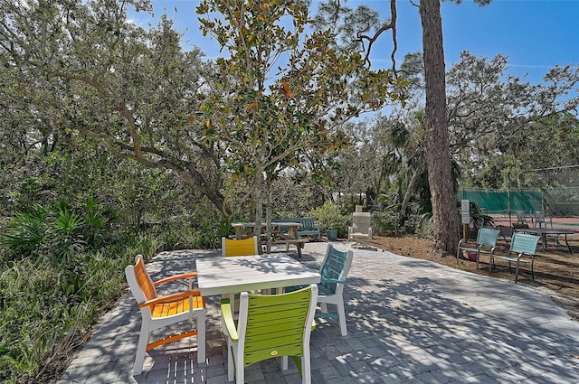 view of patio with fence and outdoor dining area