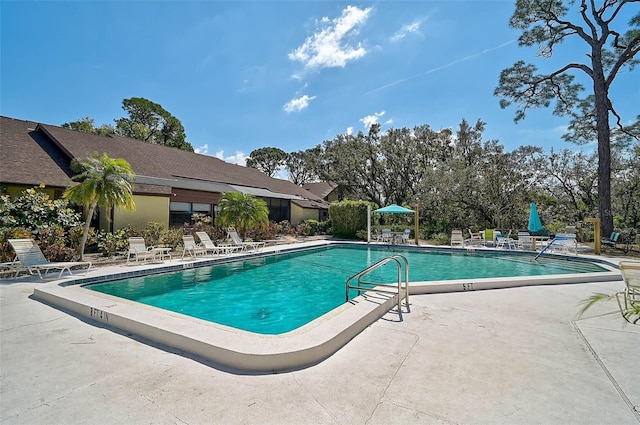 community pool featuring a patio area