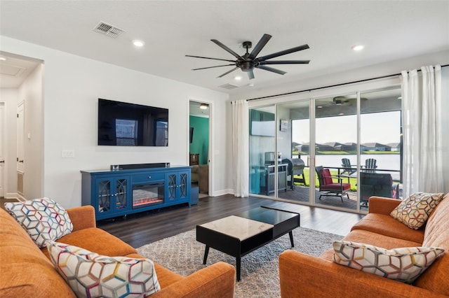 living area featuring ceiling fan, wood finished floors, visible vents, and recessed lighting