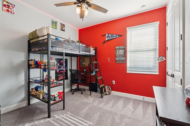 bedroom featuring carpet floors and baseboards