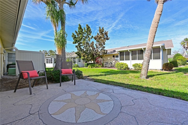 view of patio / terrace featuring a sunroom