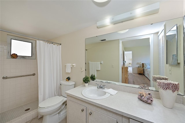 bathroom with visible vents, tiled shower, toilet, ensuite bathroom, and vanity