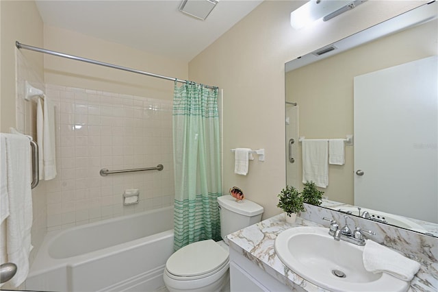 bathroom featuring visible vents, vanity, toilet, and shower / bath combo with shower curtain