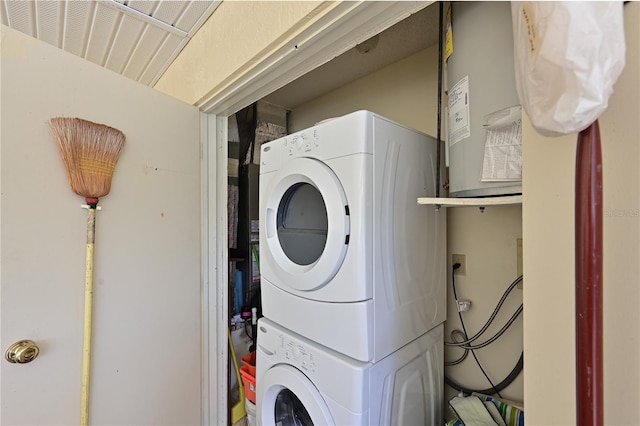 washroom featuring laundry area and stacked washer and clothes dryer