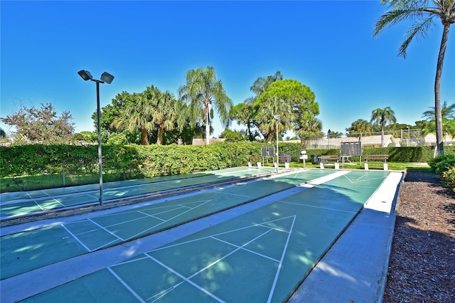 view of home's community featuring shuffleboard