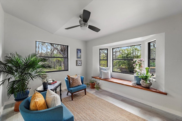 sitting room featuring baseboards and a ceiling fan