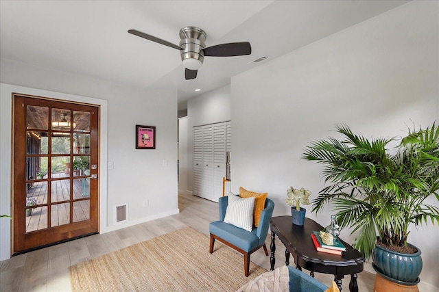 living area with recessed lighting, wood finished floors, visible vents, and ceiling fan