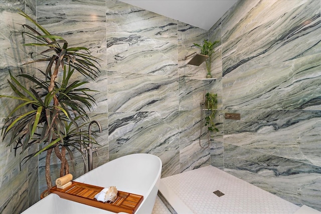 bathroom with tiled shower, tile walls, and a freestanding tub