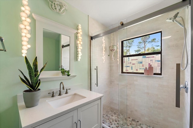 bathroom featuring a stall shower and vanity